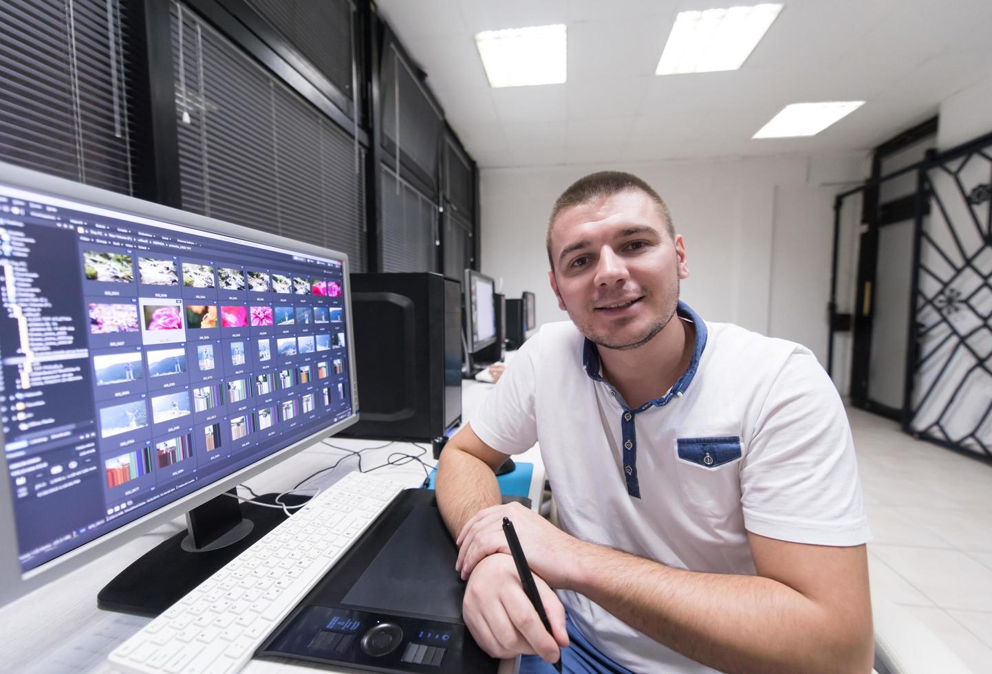 photo editor at his desk