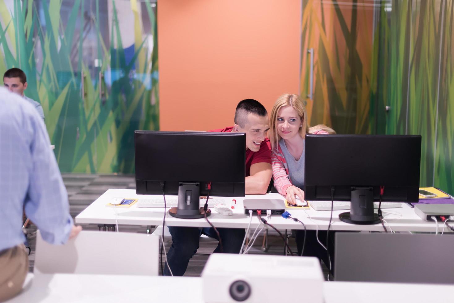 teacher and students in computer lab classroom photo