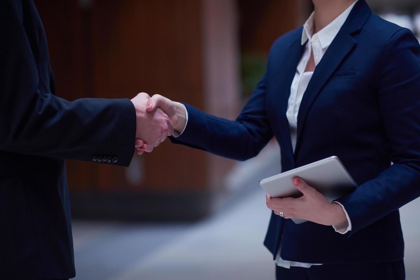 business man and woman hand shake photo