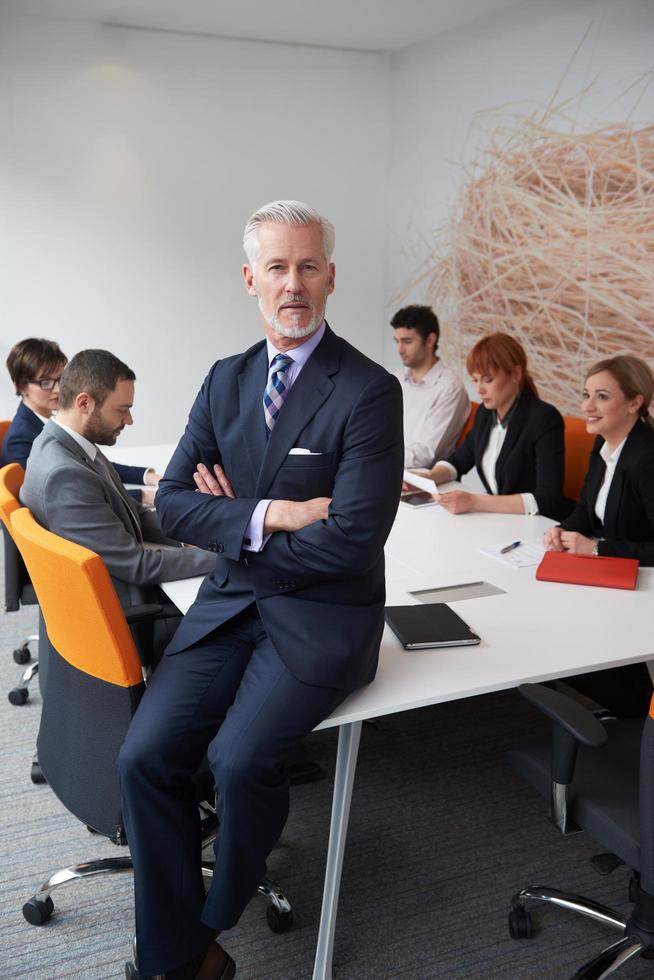 senior business man with his team at office photo