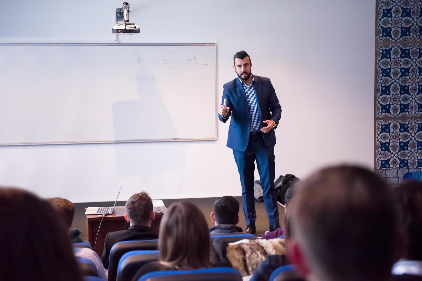 successful businessman giving presentations at conference room photo