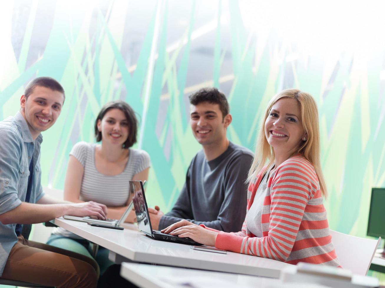 group of students study together in classroom photo