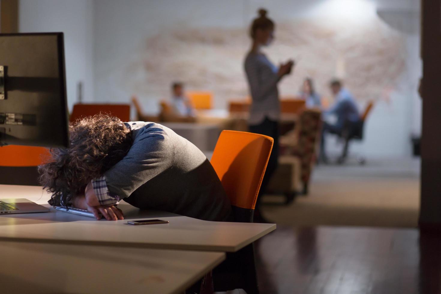 businessman relaxing at the desk photo