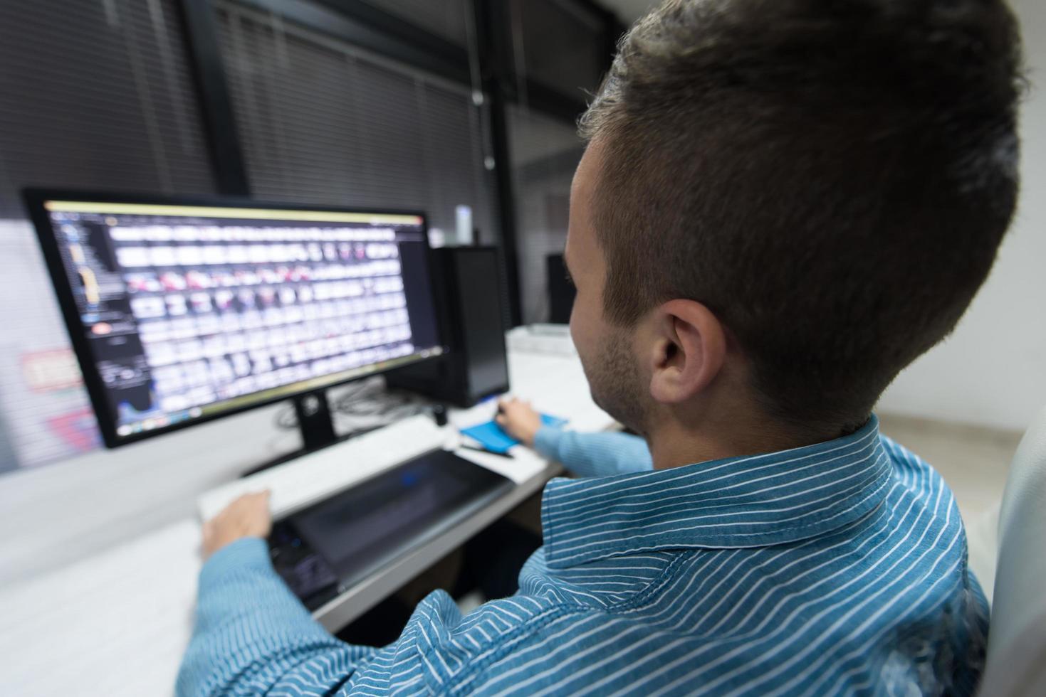 photo editor at his desk