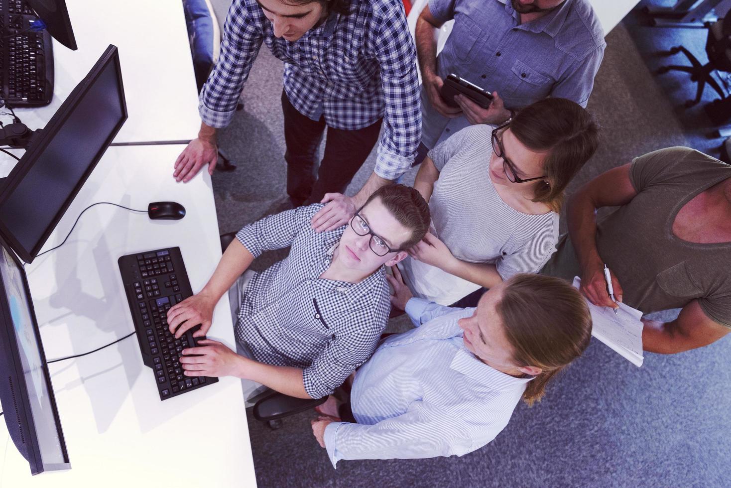 startup business people group working as team to find solution photo