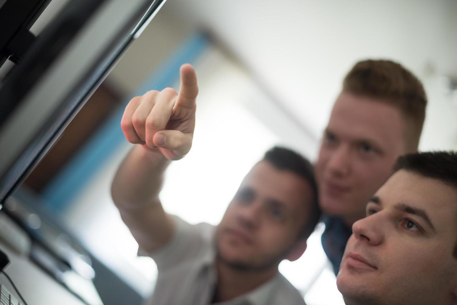 a group of graphic designers at work photo