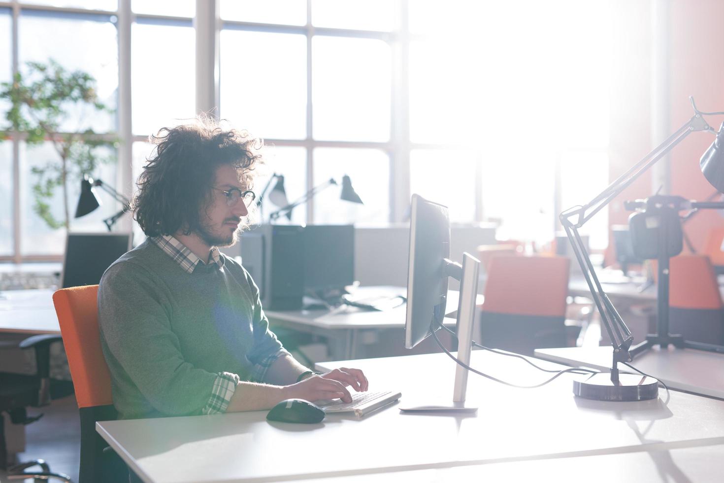 businessman working using a computer in startup office photo