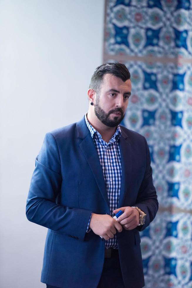 successful businessman giving presentations at conference room photo