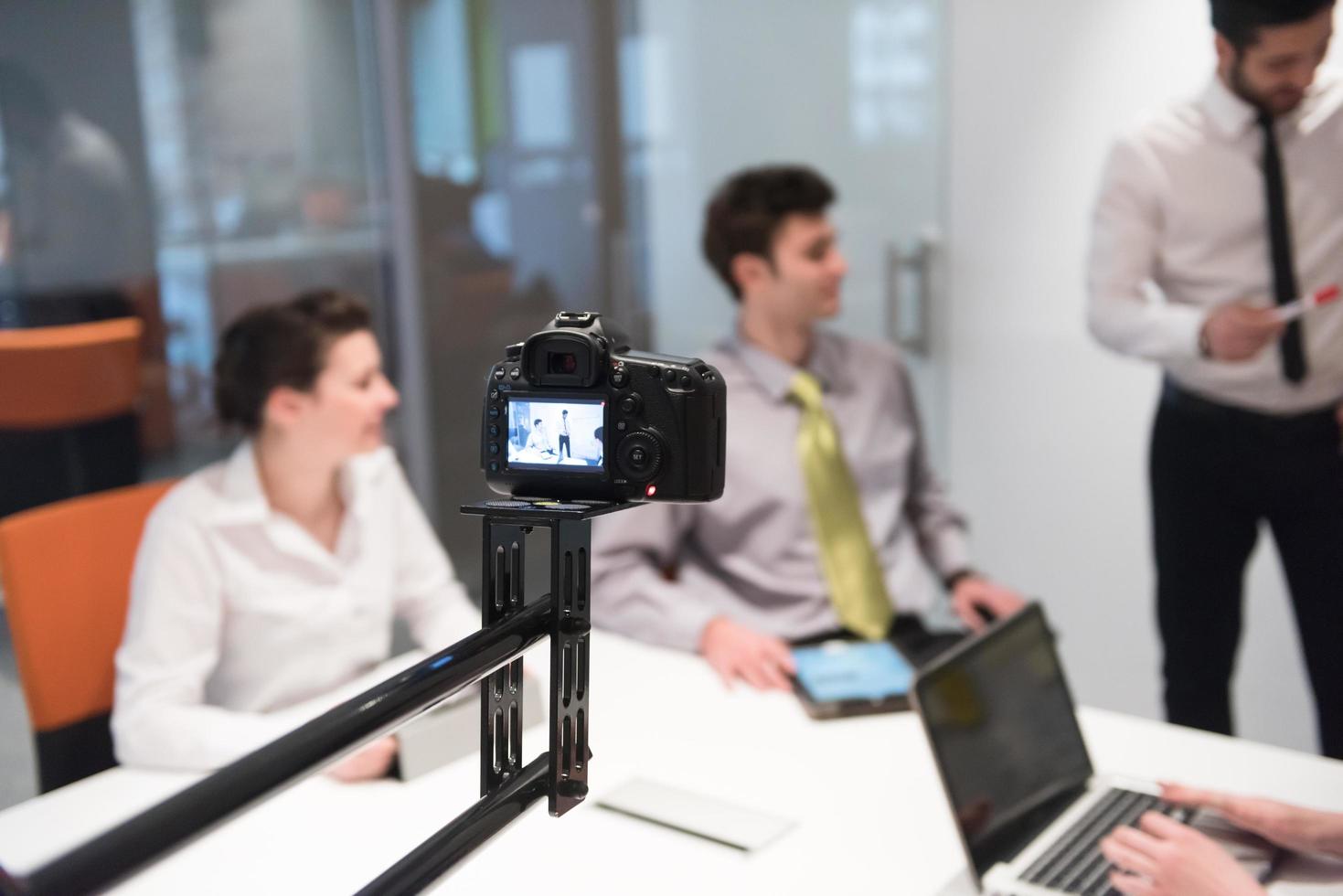 business people group brainstorming and taking notes to flip board photo