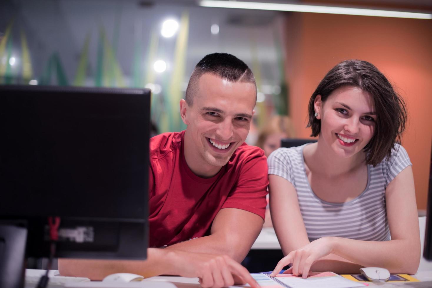 technology students group working  in computer lab school  classroom photo