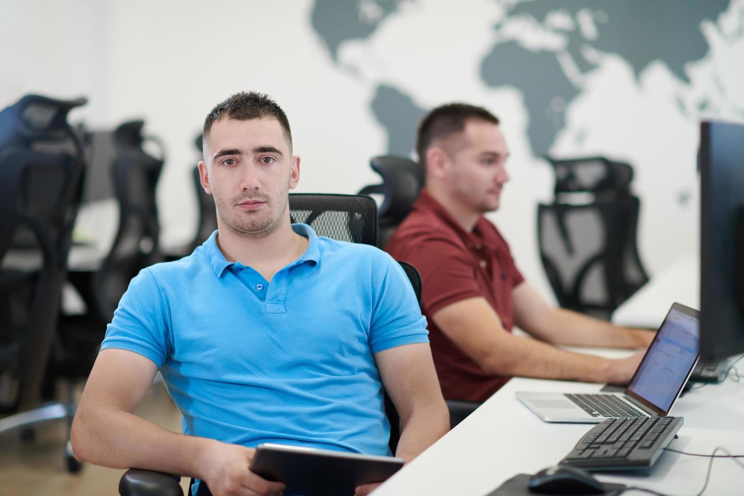 two male software developers working on computer photo