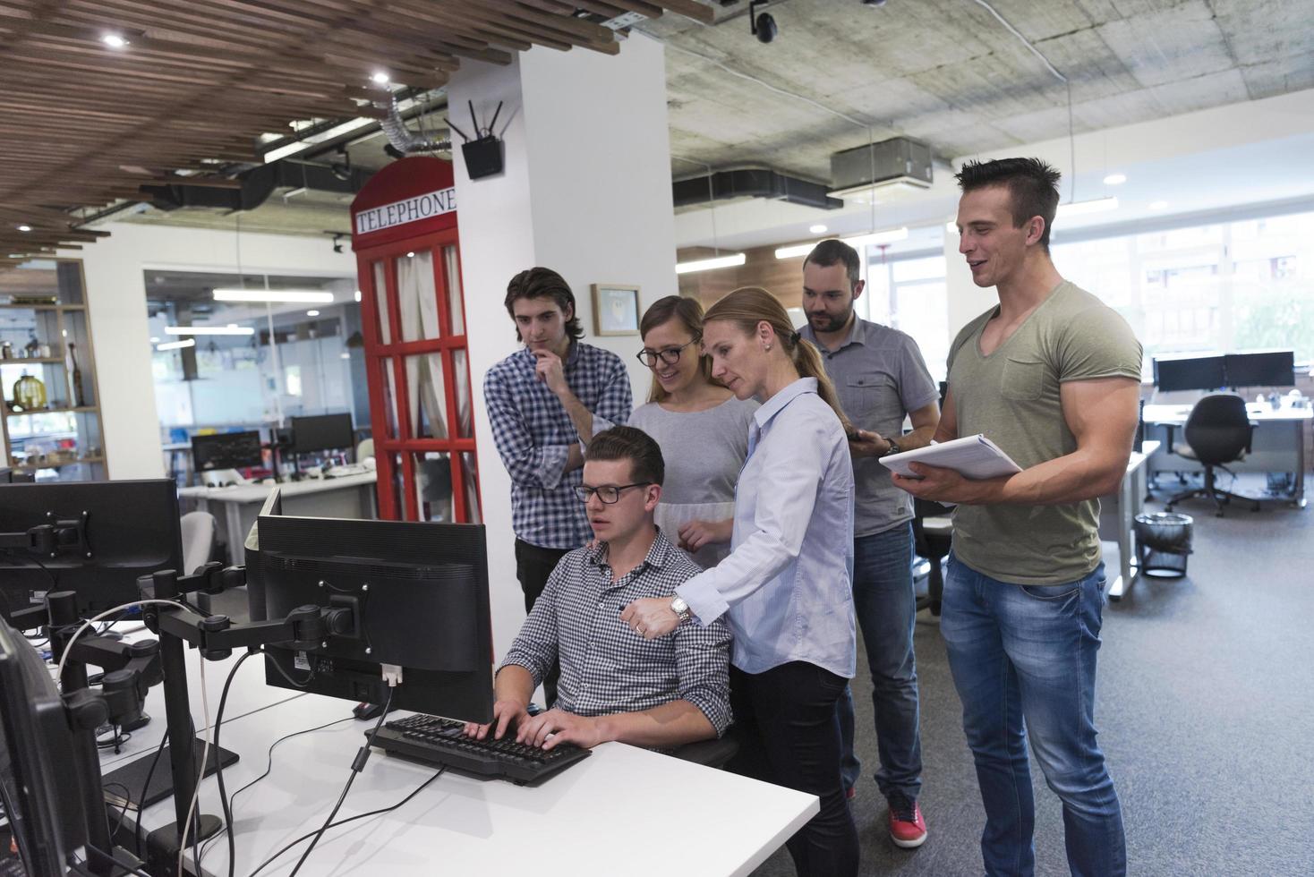 startup business people group working as team to find solution photo