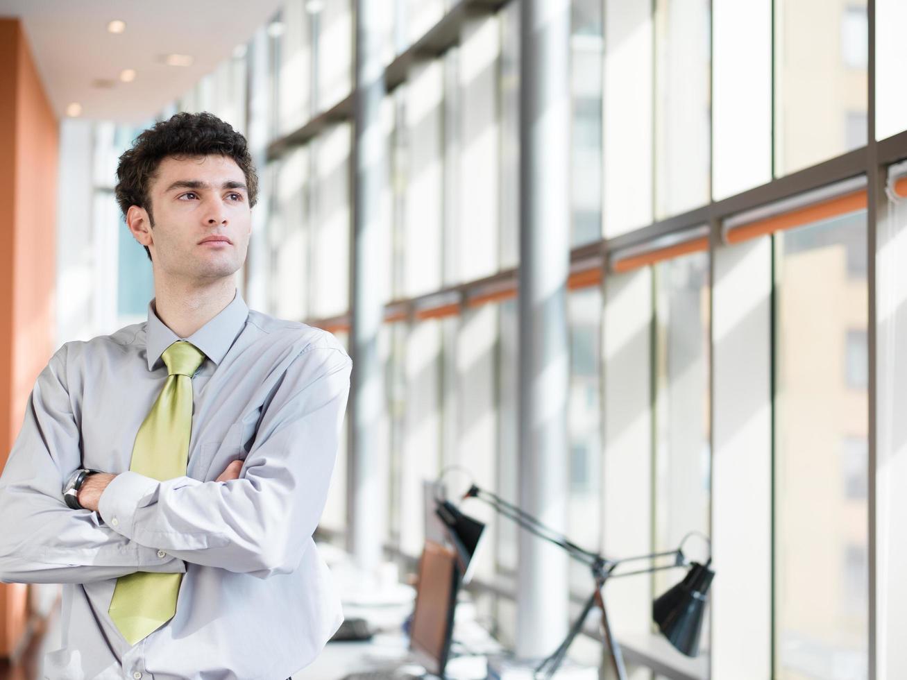 portrait of young business man at modern office photo