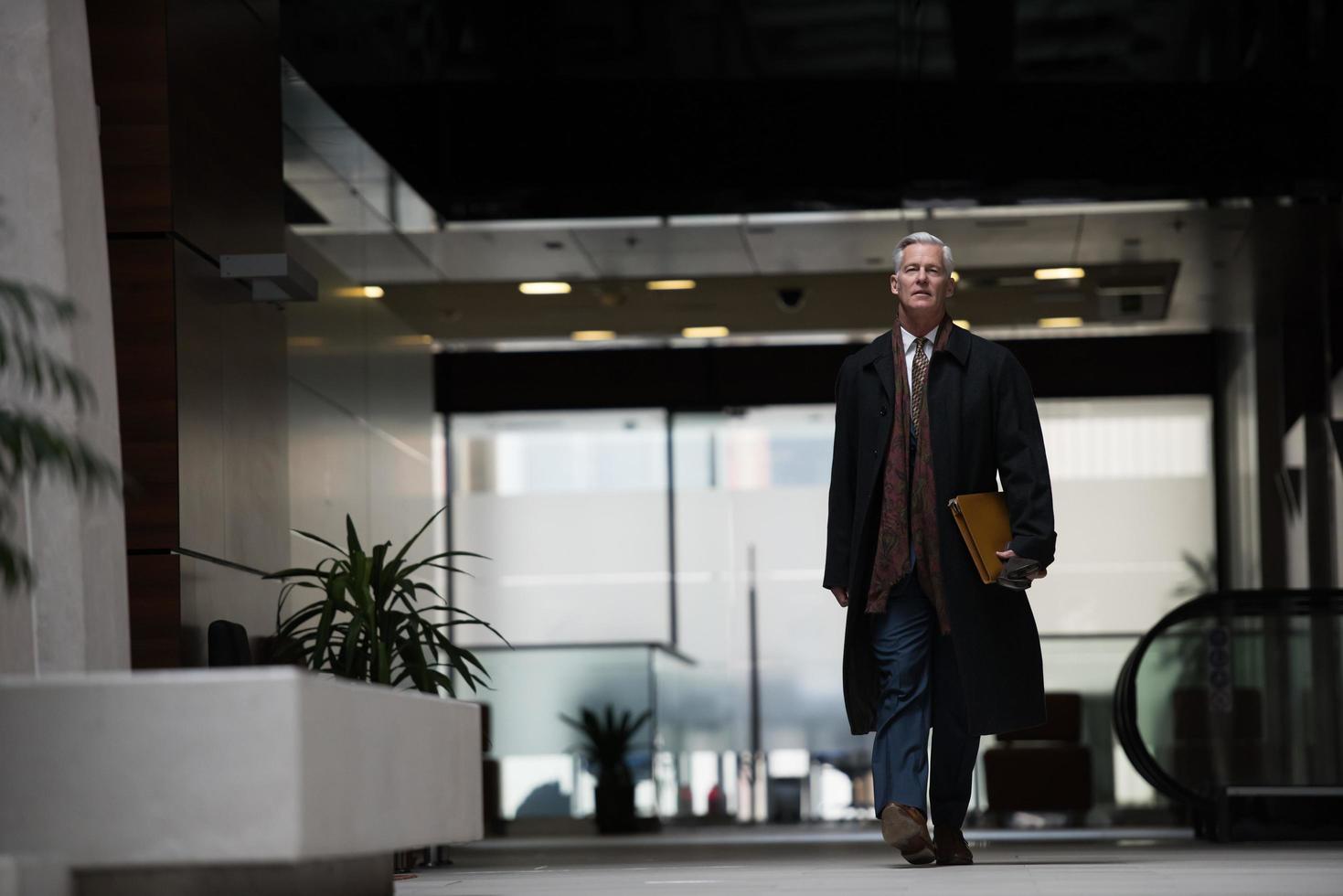 handsome senior business man walking photo