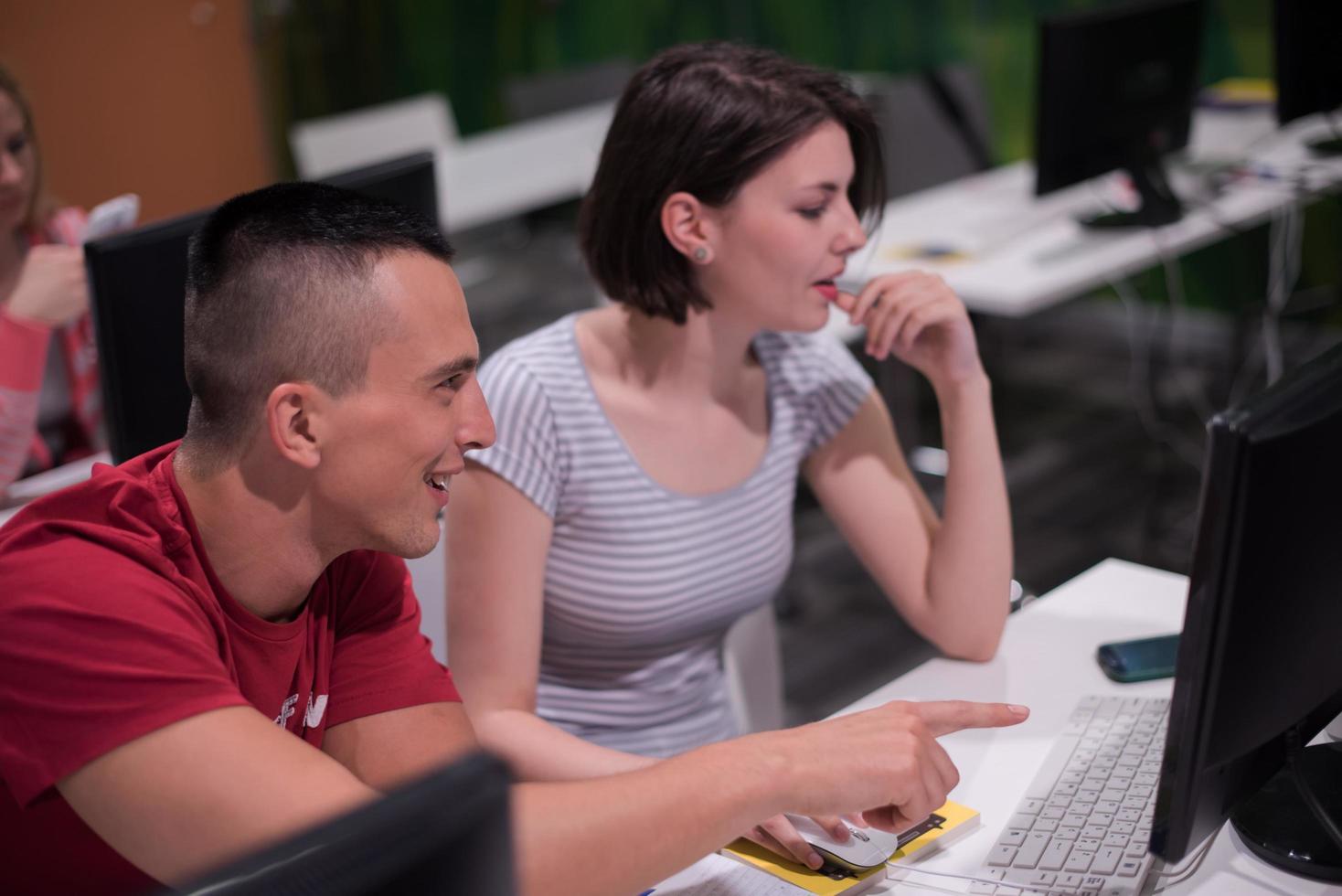 technology students group working  in computer lab school  classroom photo
