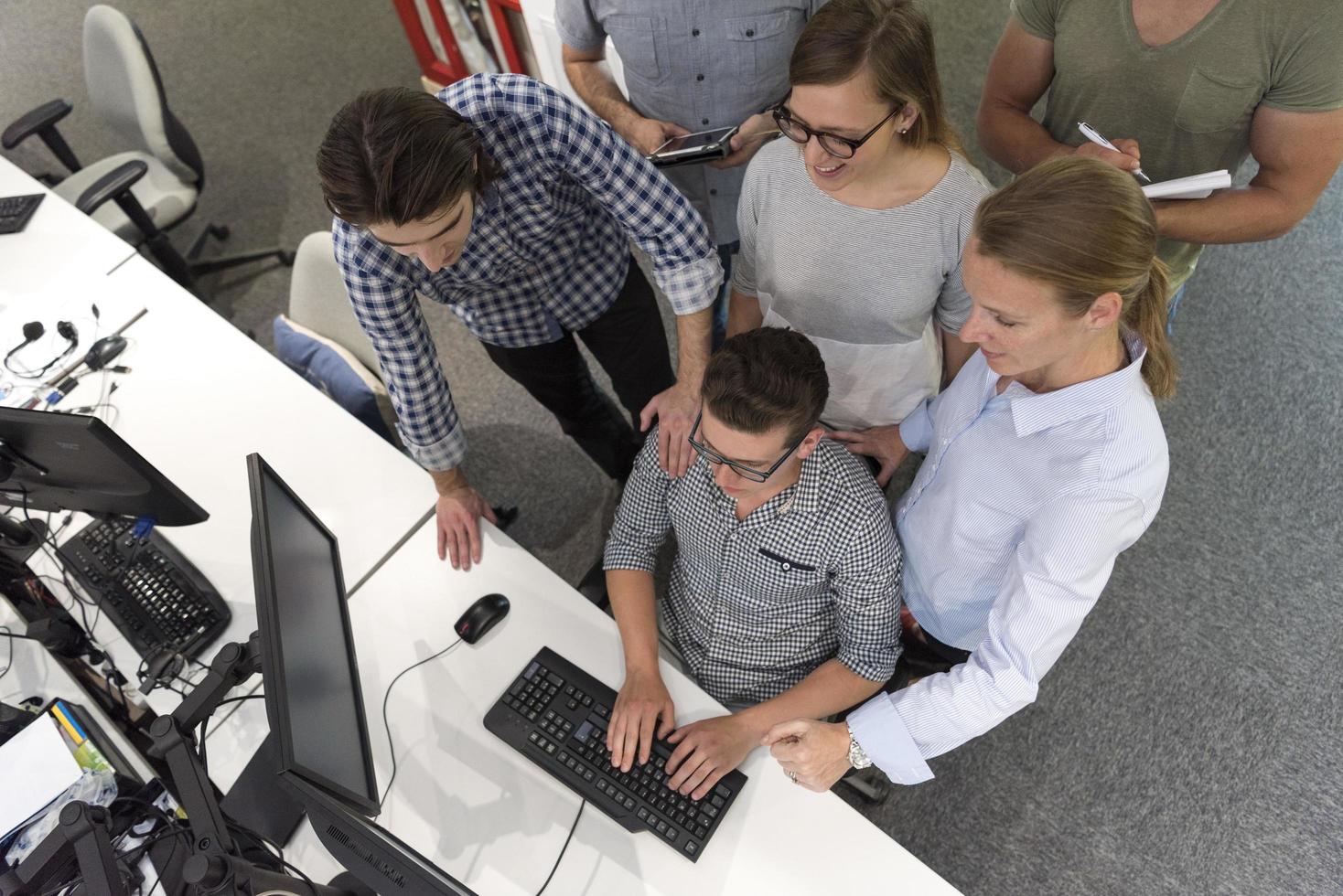 startup business people group working as team to find solution photo