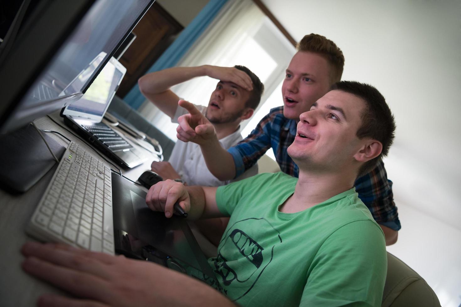 a group of graphic designers at work photo