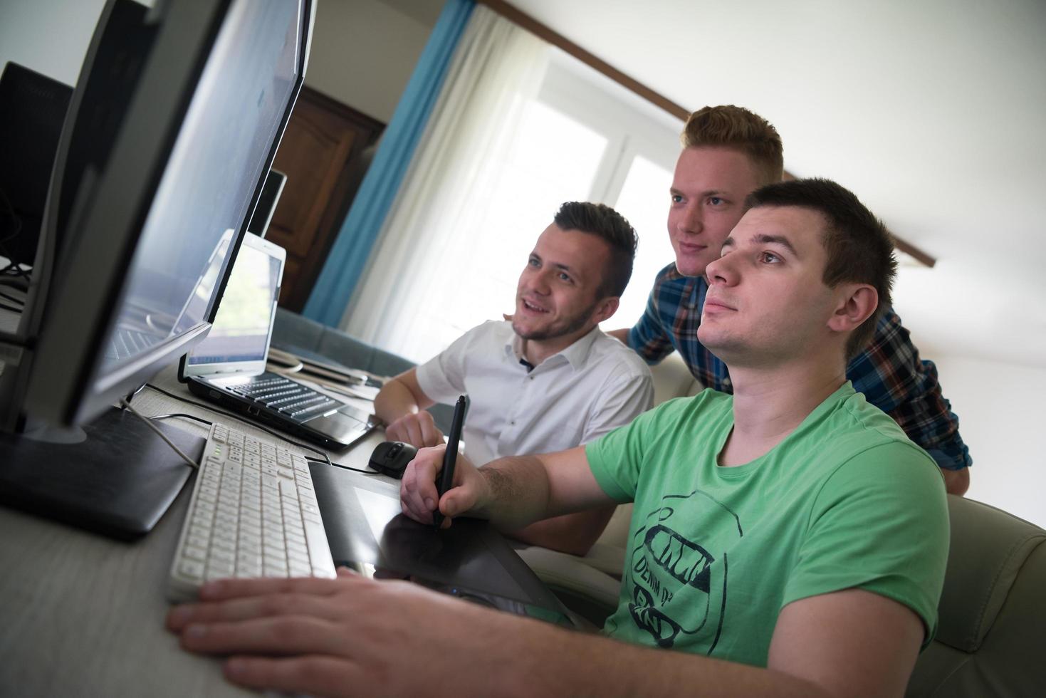 a group of graphic designers at work photo