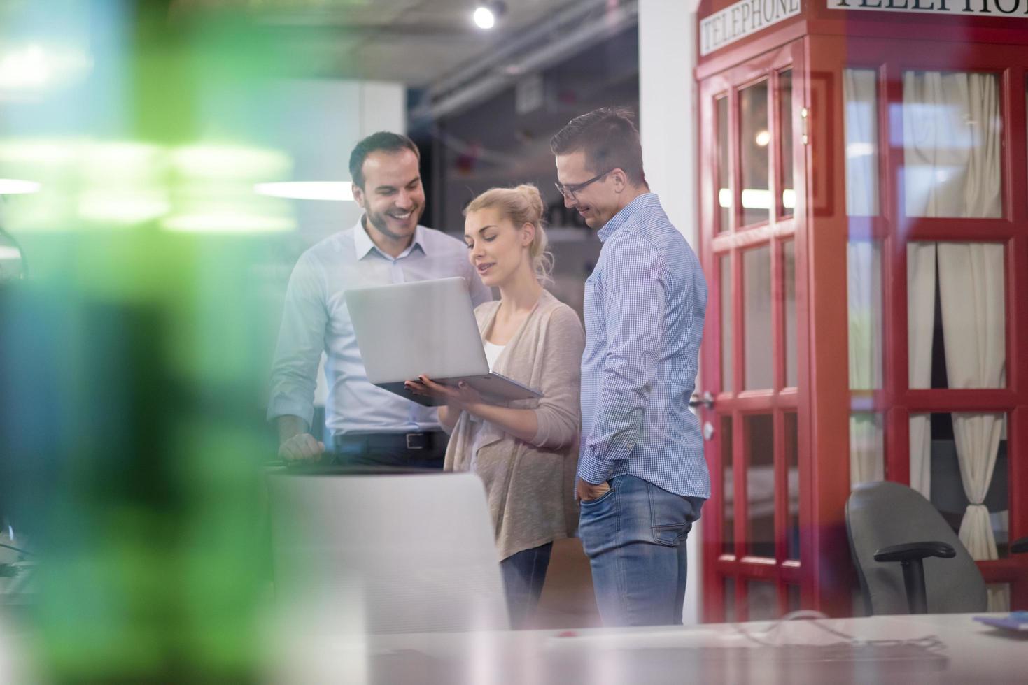 Business team Working With laptop in creative office photo