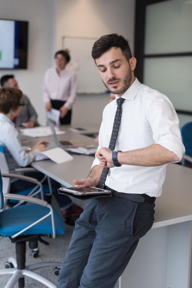 young business man with tablet at office meeting room photo