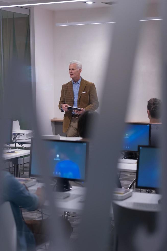 teacher and students in computer lab classroom photo