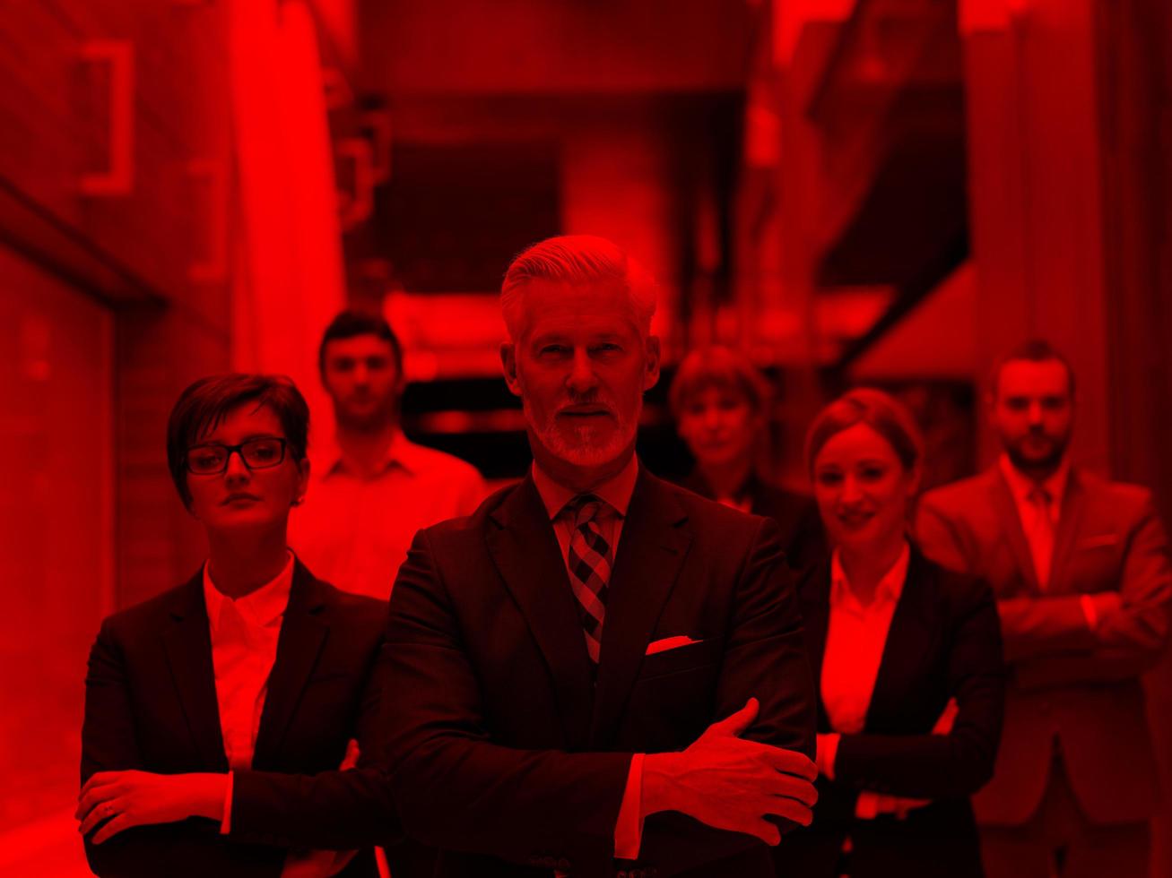 senior business man with his team at office photo