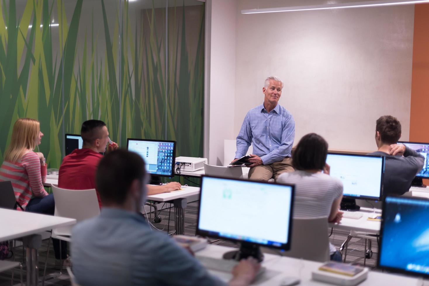 teacher and students in computer lab classroom photo