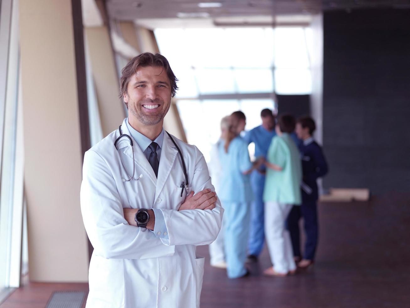 group of medical staff at hospital, doctor in front of team photo
