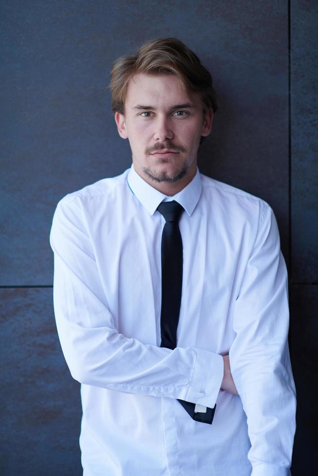 portrait of startup businessman in a white shirt with a tie photo