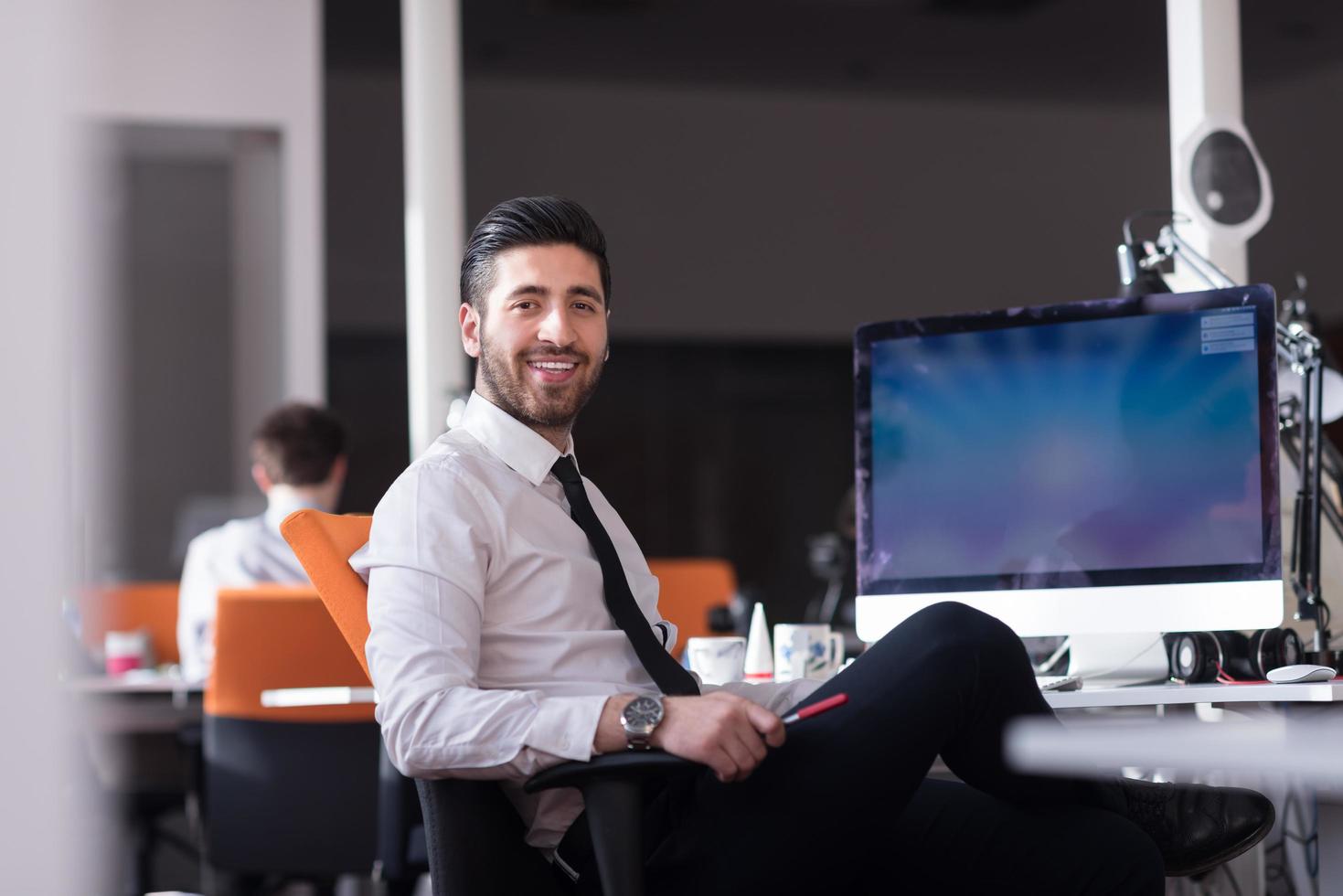 young business man  working on desktop computer photo
