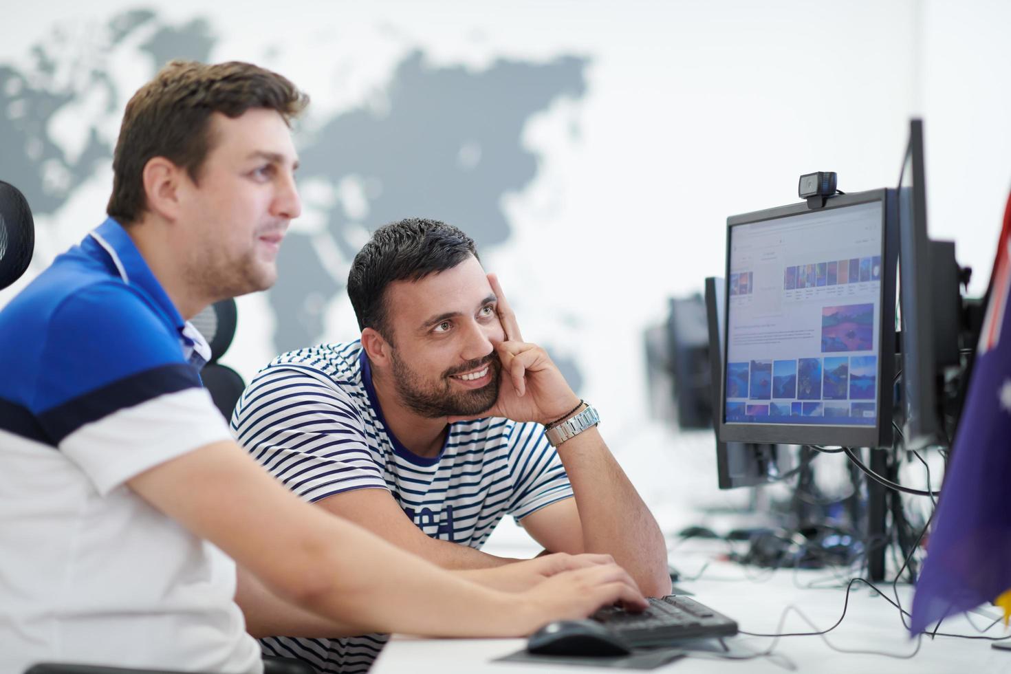 two male software developers working on computer photo