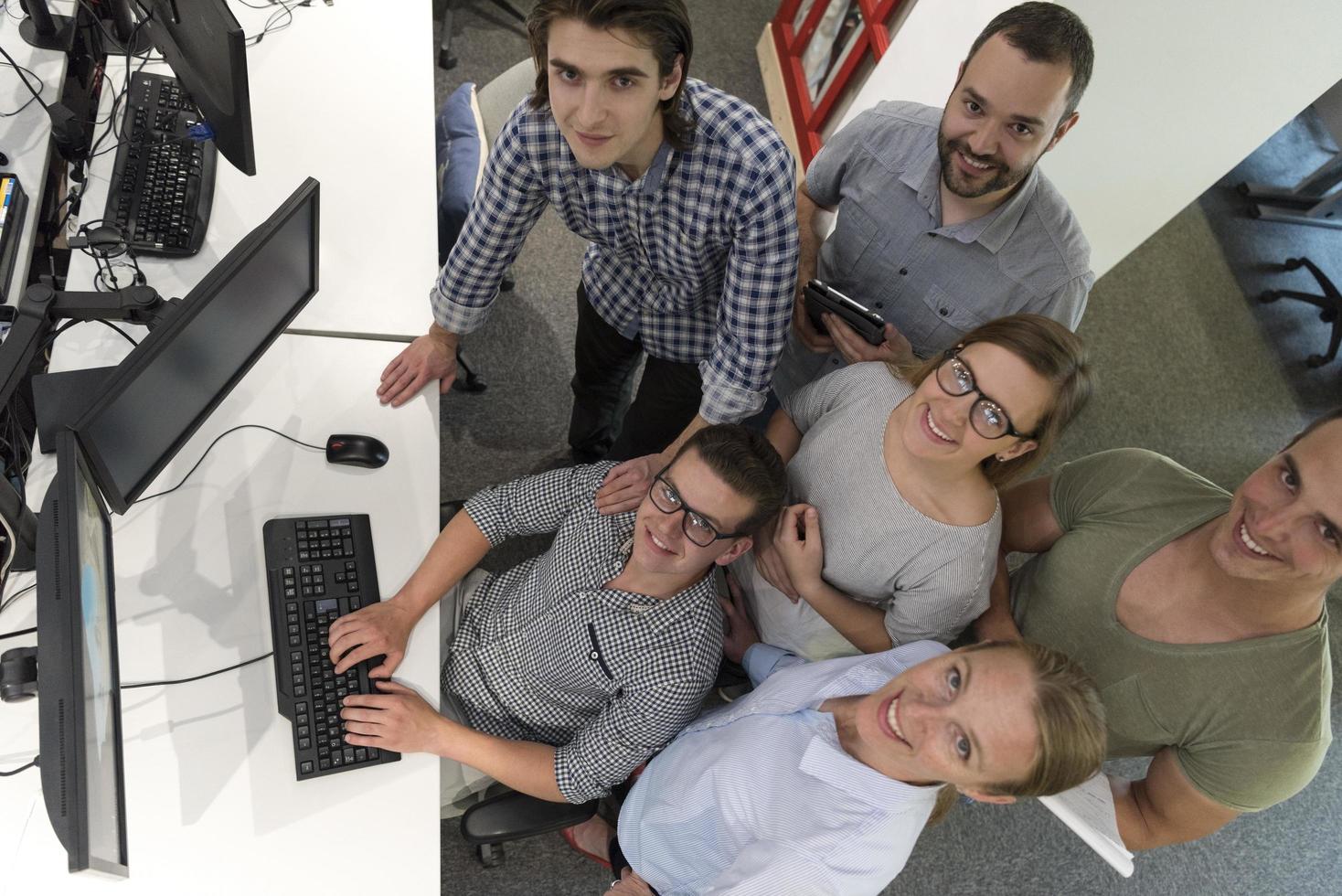 startup business people group working as team to find solution photo