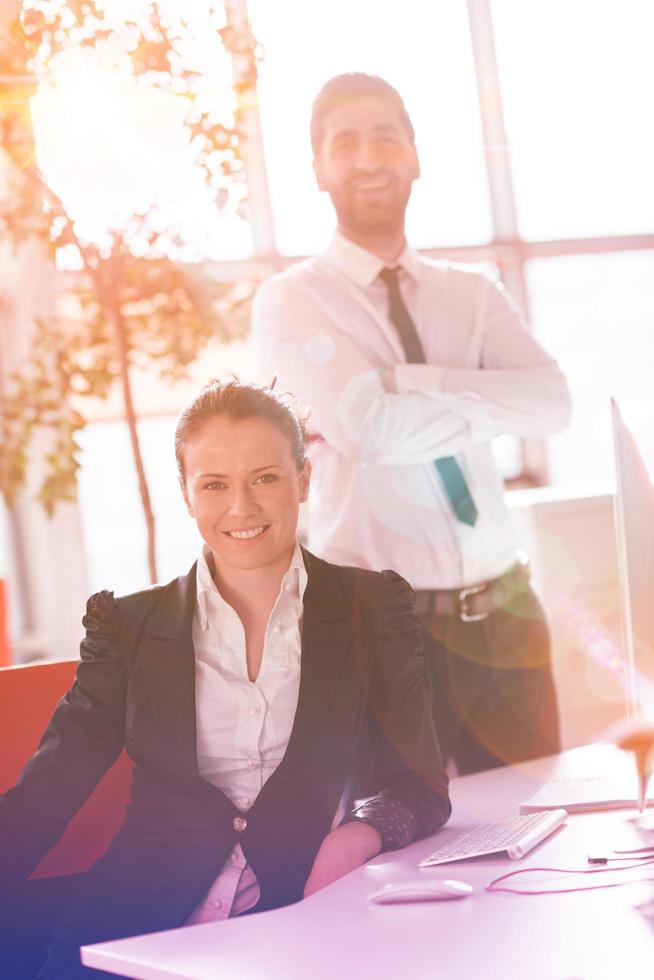 business couple working together on project, sunrise in background photo
