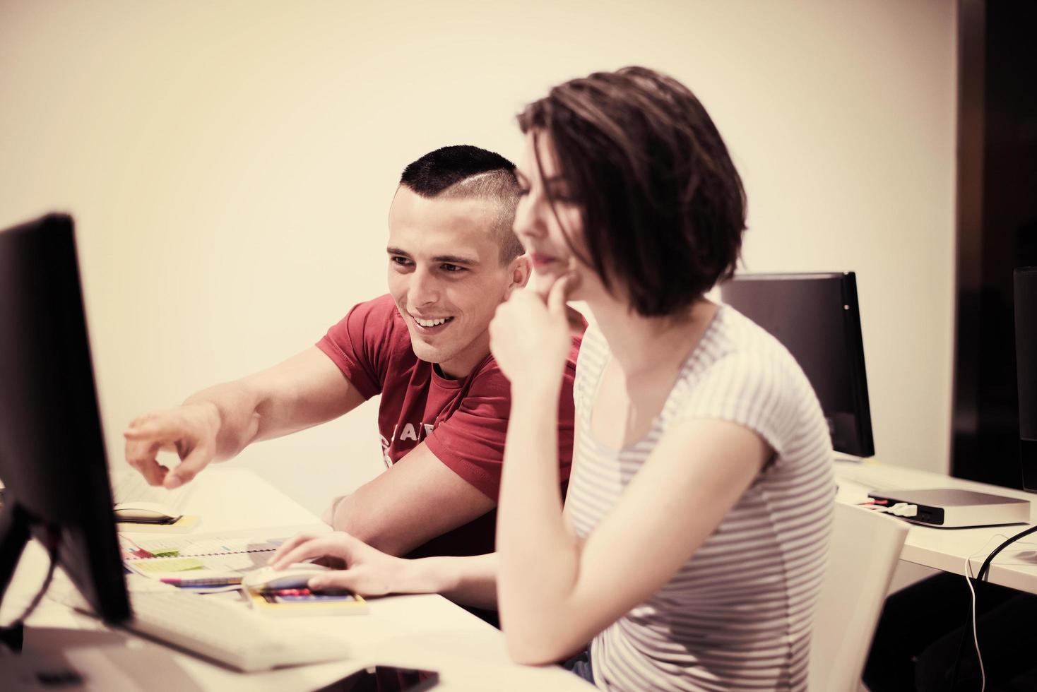 technology students group working  in computer lab school  classroom photo