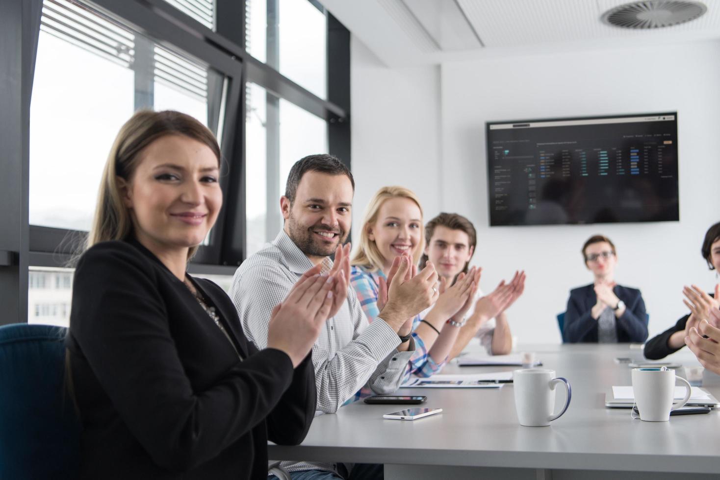Group of young people meeting in startup office photo