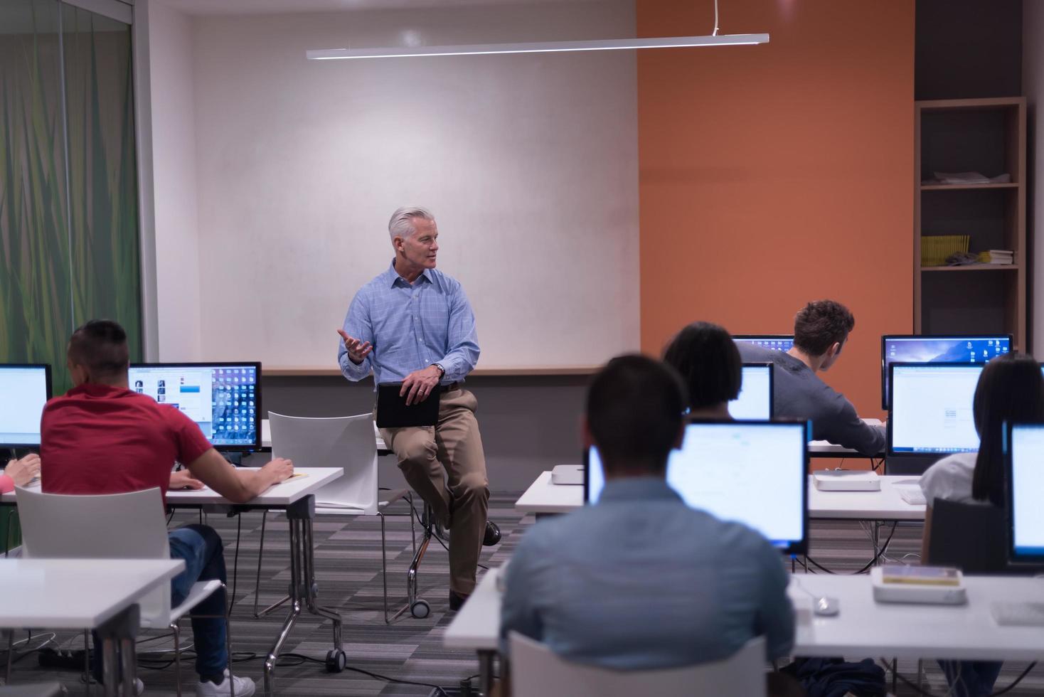 teacher and students in computer lab classroom photo