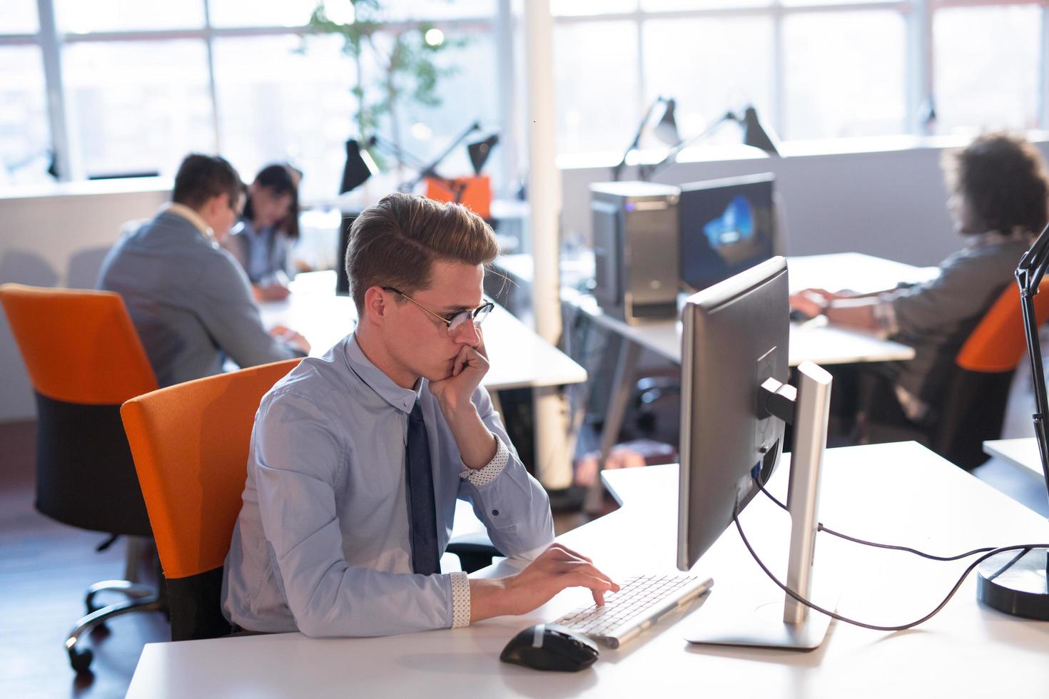 businessman working using a computer in startup office photo