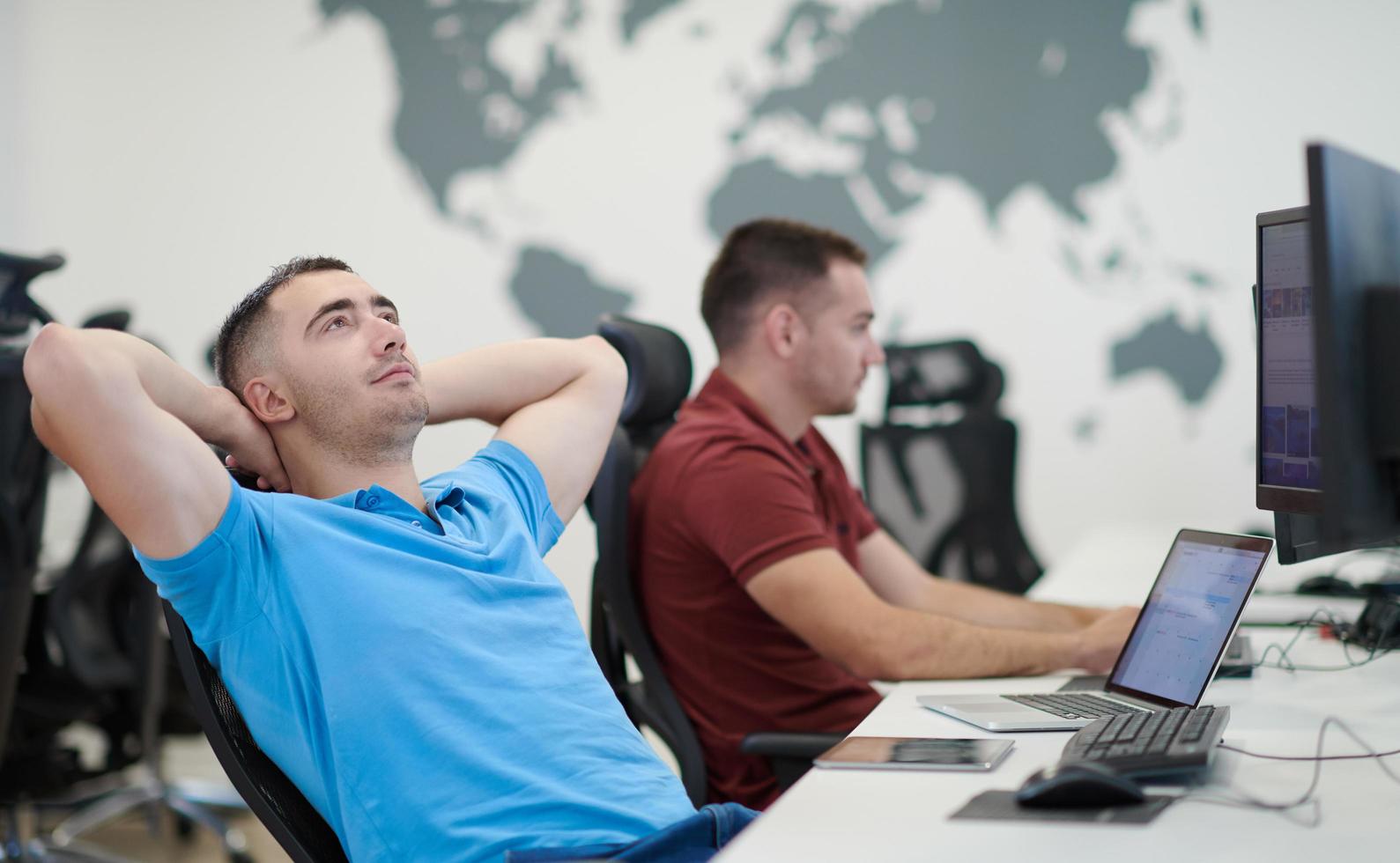 two male software developers working on computer photo