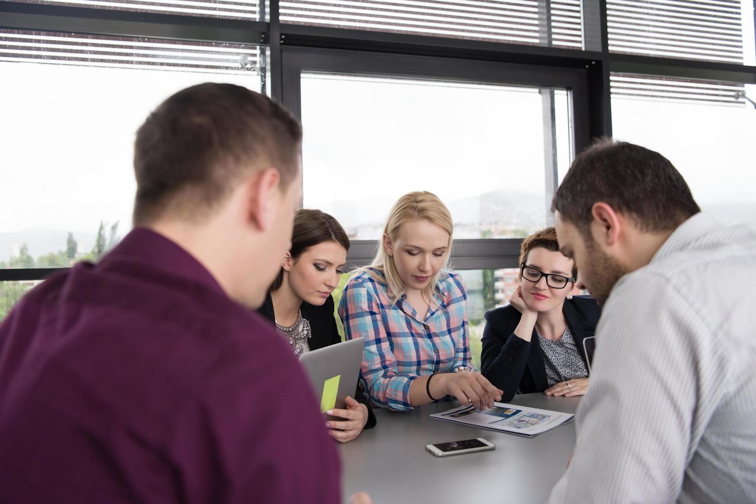 Group of young people meeting in startup office photo