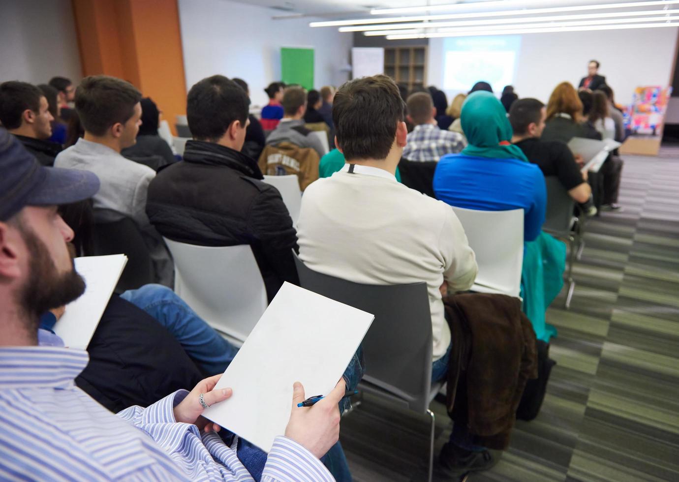 taking notes on business conference photo
