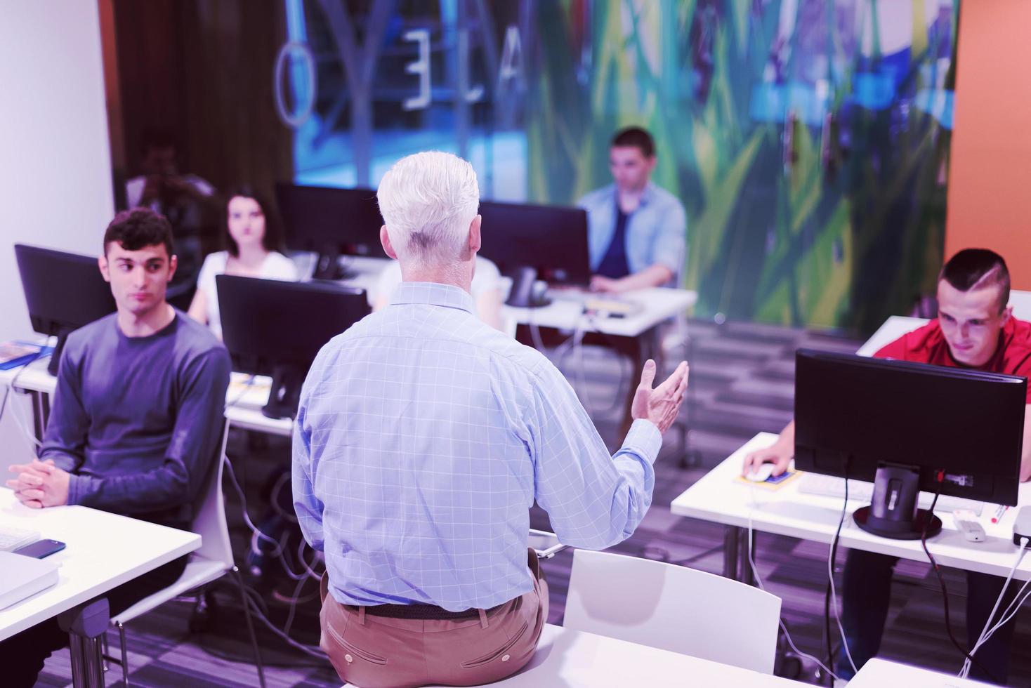 teacher and students in computer lab classroom photo