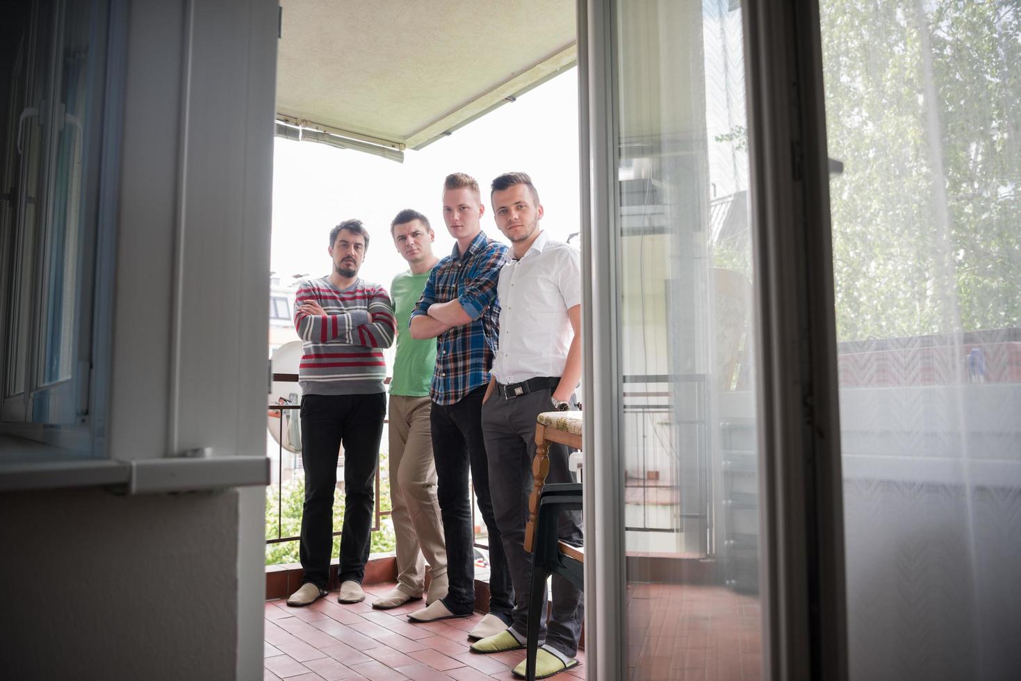 group of people standing at balcony photo