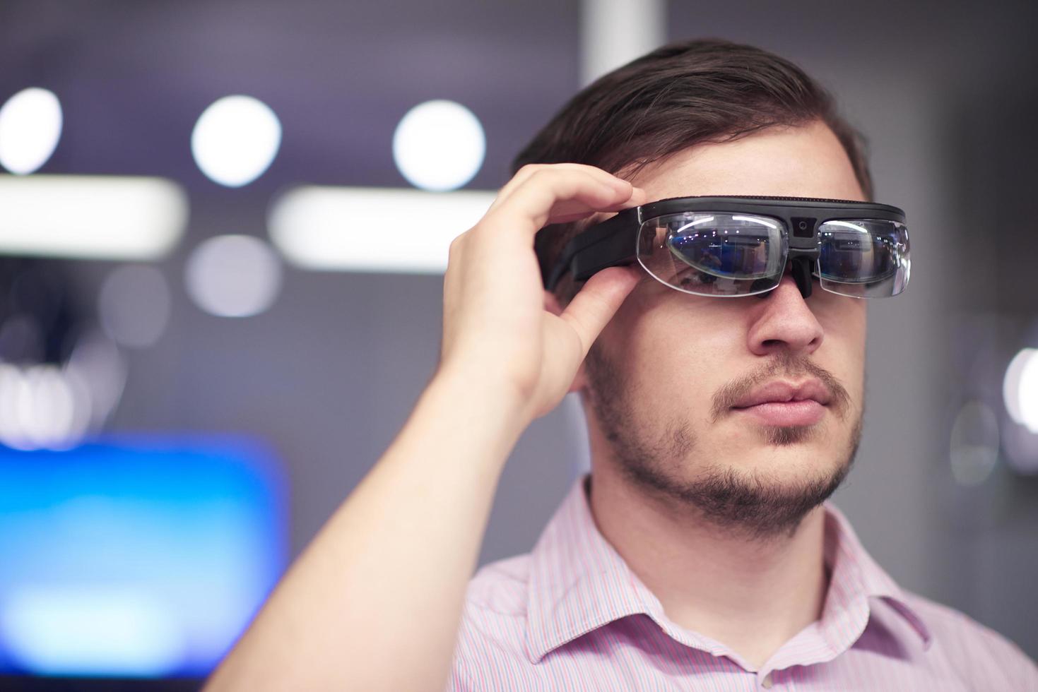 man using virtual reality gadget computer glasses photo