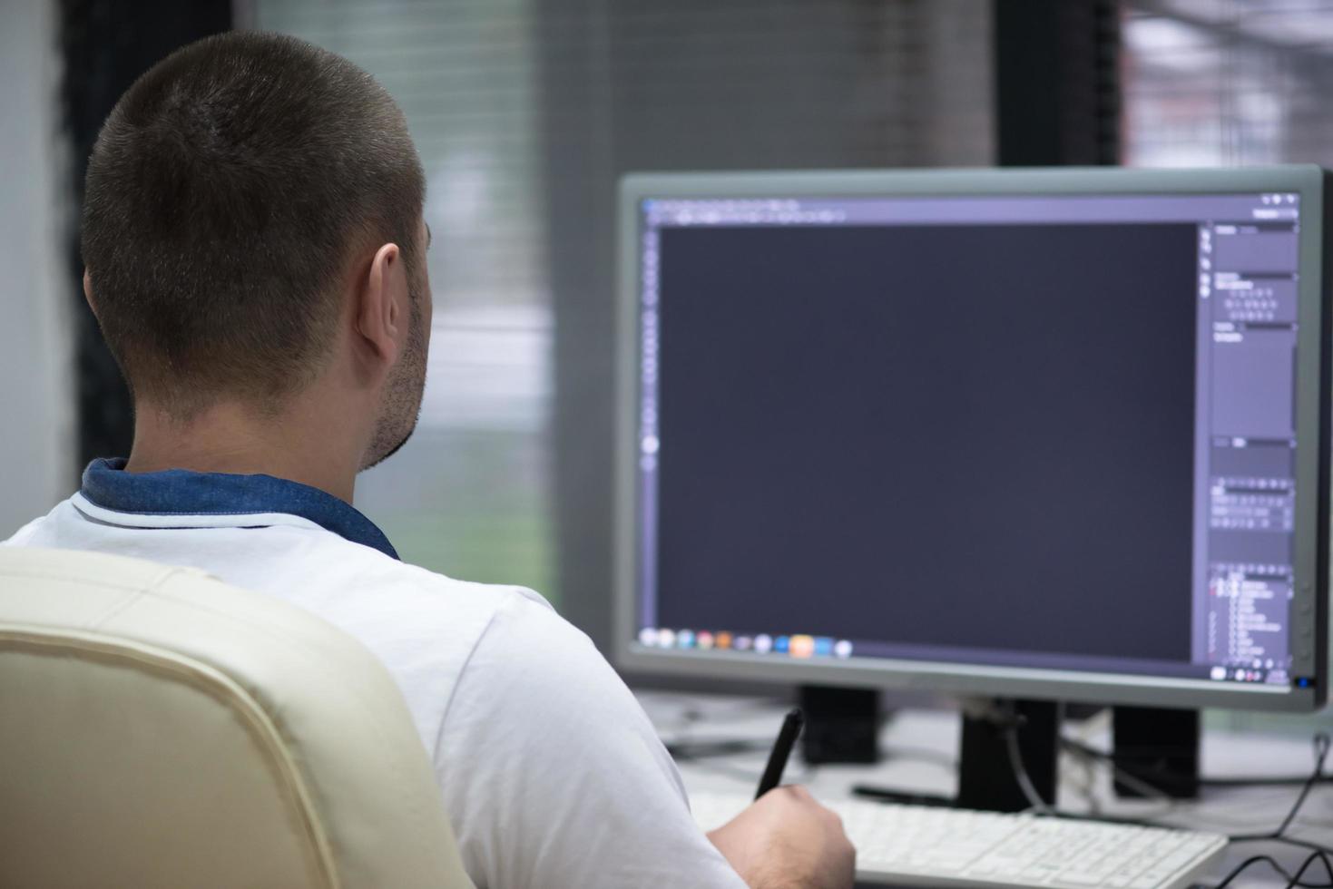 photo editor at his desk