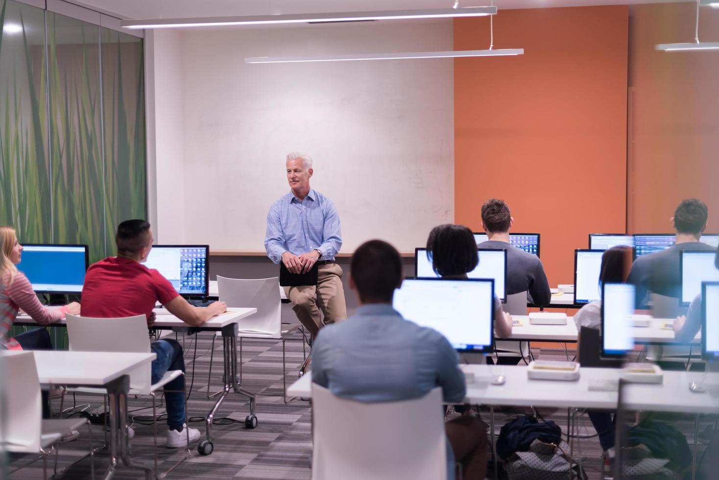 teacher and students in computer lab classroom photo
