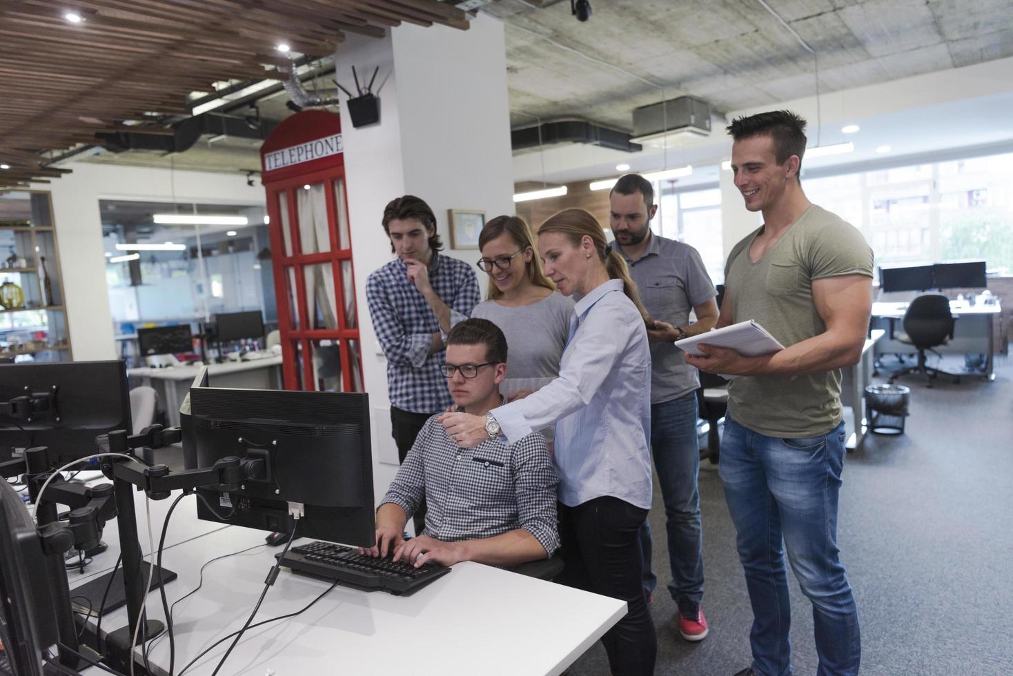 startup business people group working as team to find solution photo
