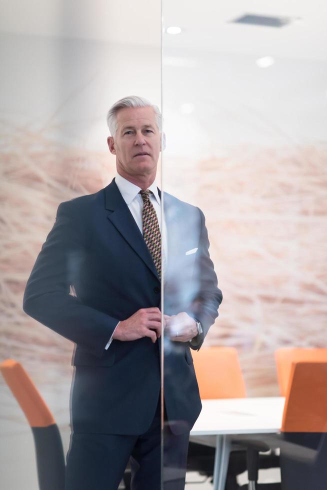 portrait of handsome senior business man at modern office photo