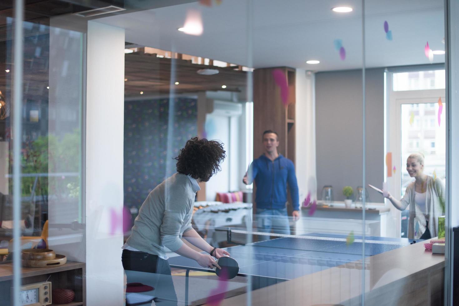 startup business team playing ping pong tennis photo