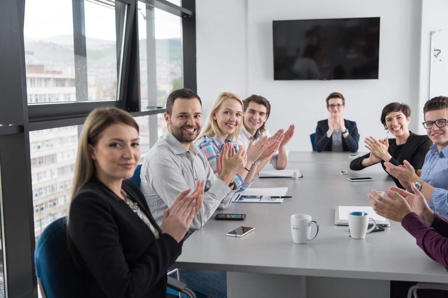 Group of young people meeting in startup office photo