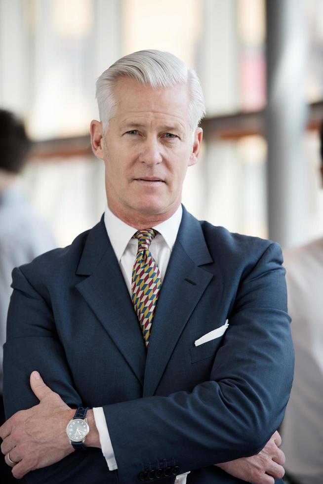 portrait of handsome senior business man at modern office photo